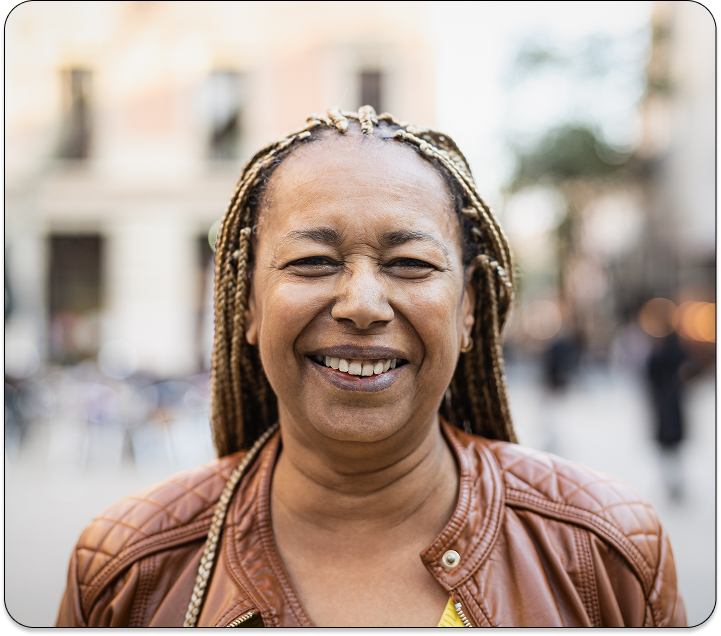 happy african woman wearing a brown jacket